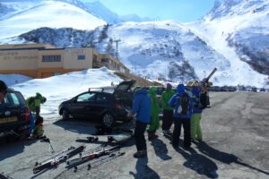 Ski tourers in a car park