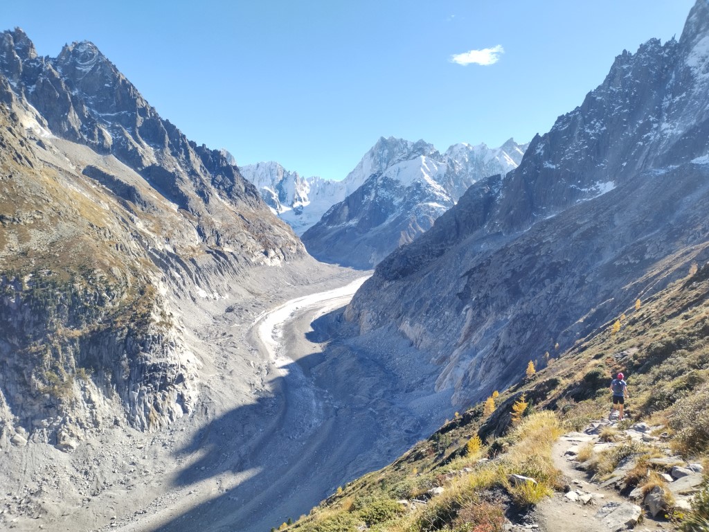 View over Mer de Glace glacier, runner in foreground