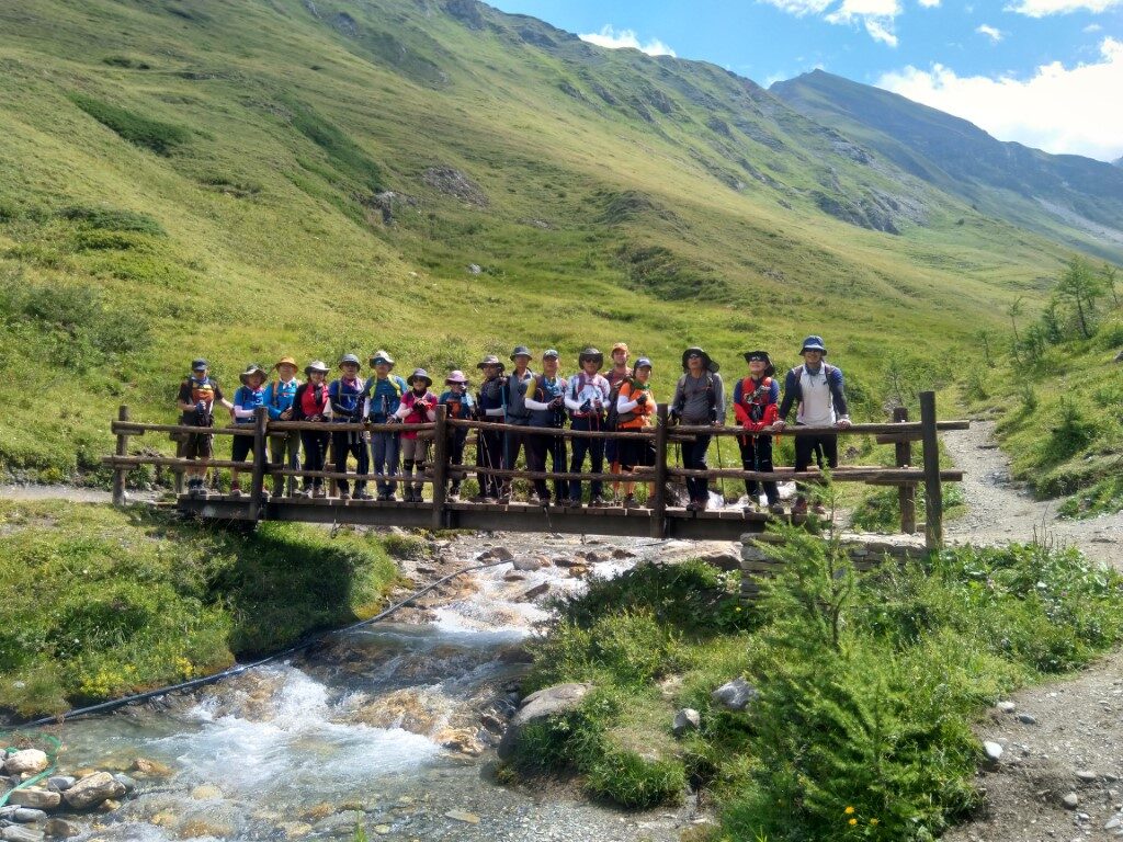 Hikers grouped on a bridge