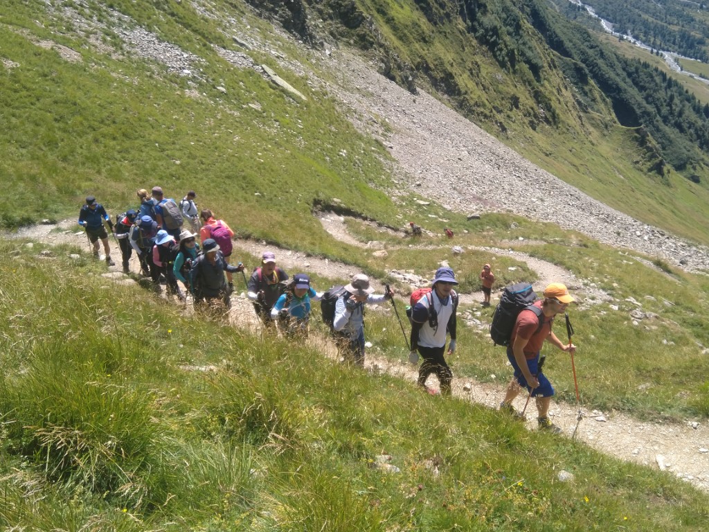Hikers climbing a steep path