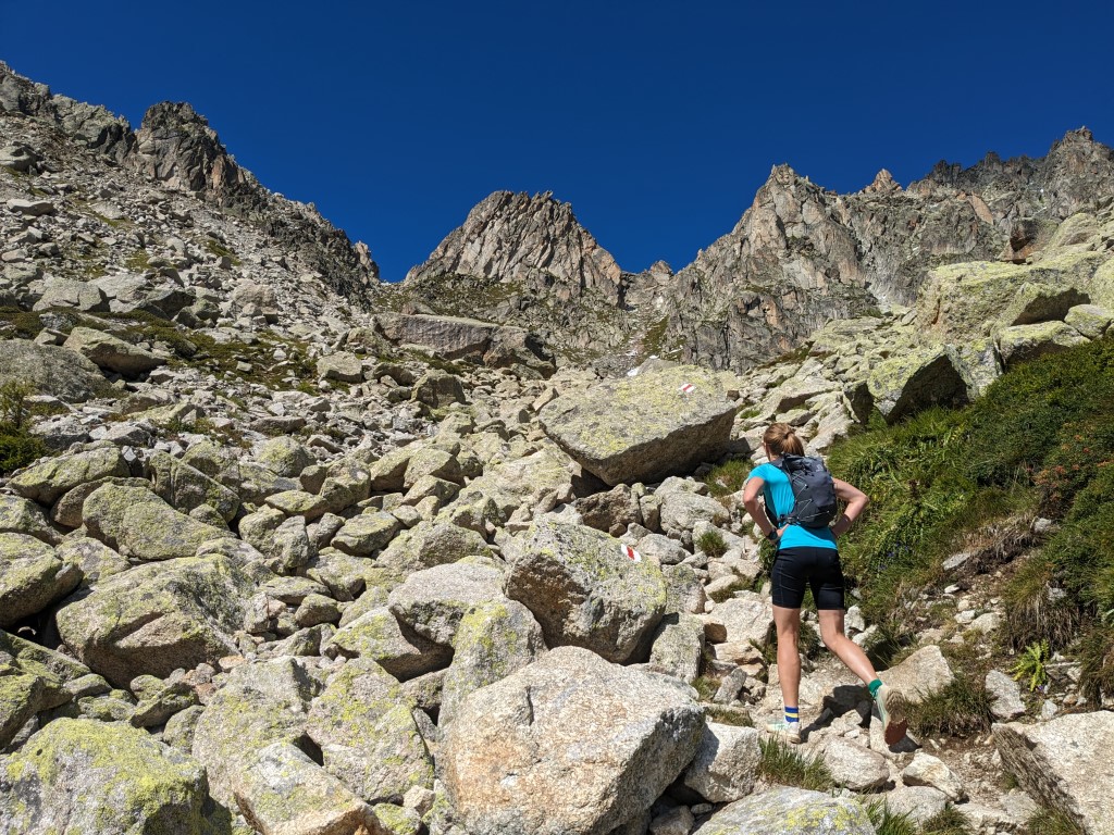 Hiker on rocky ground on the TMB