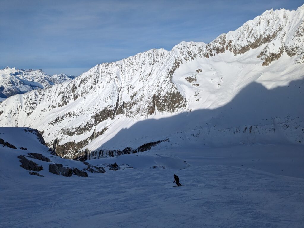 Skier descending off-piste